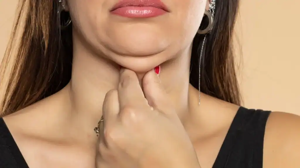 An image of a woman with double chin, sad, worried : Non Surgical Double Chin Removal Treatment in Yeovil, UK